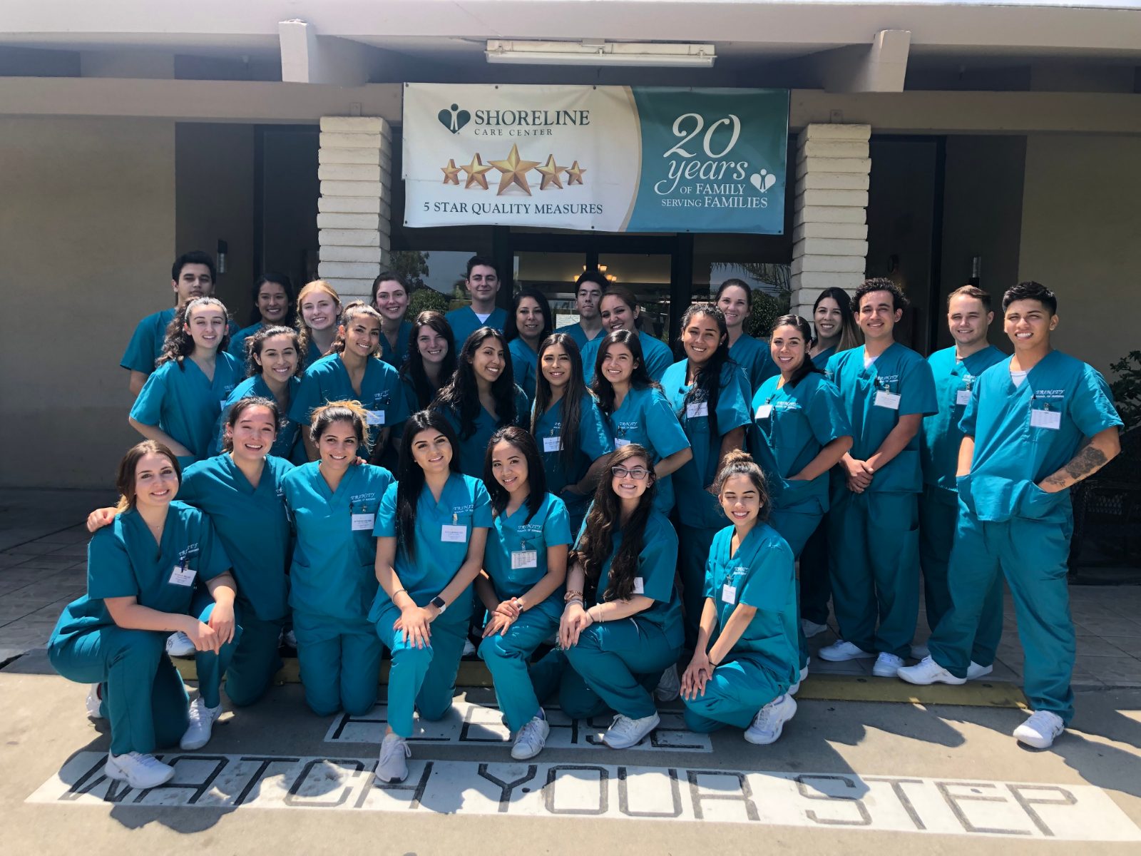 Trinity School of Nursing community gathered outside a care center