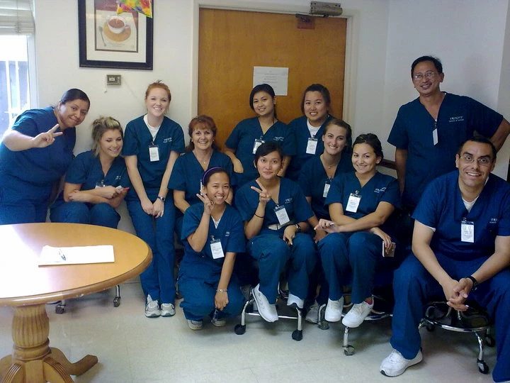 Trinity students and staff gathered in a classroom