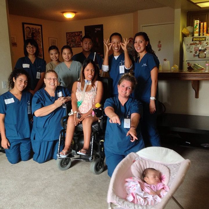 A group holding flowers at a celebration